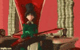 a cartoon character is sitting in a red chair holding a book .