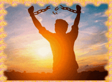 a silhouette of a man holding chains in the air
