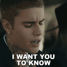 justin bieber says " i want you to know " in front of his face