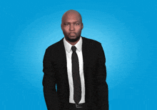 a man in a suit and tie with a blue background