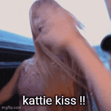a gif of a woman with the words katie kiss on it