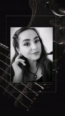 a black and white photo of a woman wearing earrings