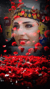 a picture of a woman surrounded by red roses with the letters t e and j in the background