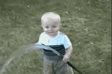 So Close Little Guy! GIF - Babydrinkingfromhose Cute Baby GIFs