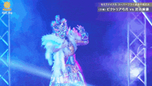 a woman in a costume is on a stage in front of a sign that says #qw img