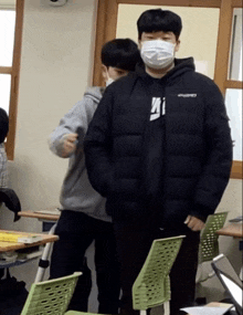 a man wearing a mask and a discovery jacket