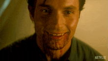 a close up of a man 's face with blood on it and a netflix logo in the corner