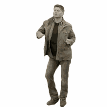 a man in a brown jacket and jeans is dancing .