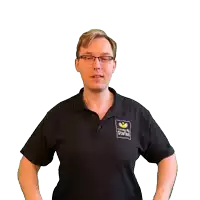 a man wearing a black shirt that says ' stefan ' on it