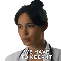 a woman with a stethoscope around her neck has the words we have to keep it on her face