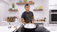 a man in an apron is cooking in a kitchen with the words made in animatica on the bottom right