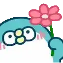 a shark is holding a pink flower in its mouth .