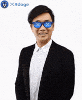 a man wearing sunglasses with x 's on them and the word xrdoge on the bottom