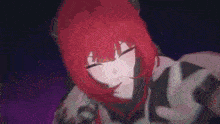 a girl with red hair is holding a dog in her arms in a dark room .