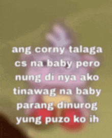 a blurred image of a stuffed animal with the words ang corny talaga
