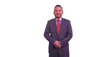 a man in a suit and tie points to a premier centro médico logo