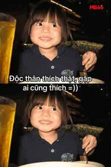 a little girl is smiling in front of a glass of beer with mb66 written on the bottom