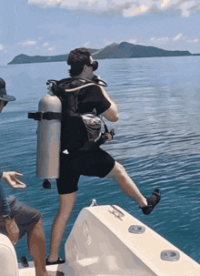 a scuba diver getting ready to dive into the water