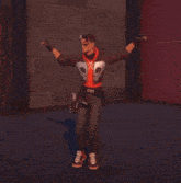 a man wearing a red hoodie with a skull on it is dancing