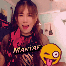 a woman with a shirt that says mantaf on it