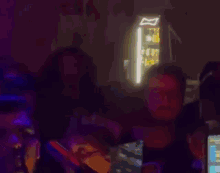 a blurred image of a man playing a dj set