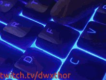 a computer keyboard with the words twitch.tv/dwxthor in red