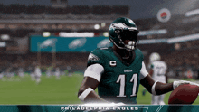 a football player for the philadelphia eagles holds a football