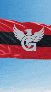 a red black and white flag with an eagle and the letter g