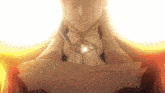 a close up of a person 's chest with a glowing pendant on it
