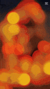 a blurred image of a christmas tree with the number 8 on the bottom right