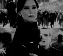 a black and white photo of a woman with the words let me go i can 't on her face