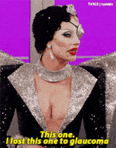 a woman in a black and silver dress says " this one "