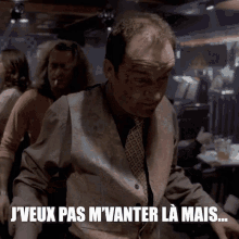 a man in a suit and tie says j'veux pas m'vander la mais