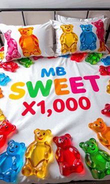a bed with gummy bears and the words " mb sweet x1,000 "