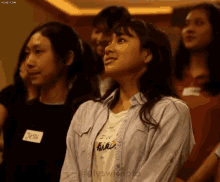 a girl wearing a name tag that says jess