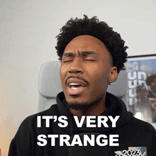 a man says it 's very strange in front of a chair