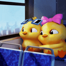 a couple of cartoon ducks wearing sunglasses and a pink bow