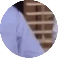 a blurry picture of a person 's shirt and tie