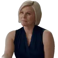 a woman with blonde hair is wearing a blue top