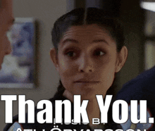 a woman says thank you while looking at another man
