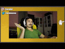 a man wearing headphones is sitting in a yellow chair .