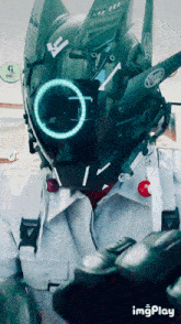 a person wearing a futuristic helmet with a circle around the eyes