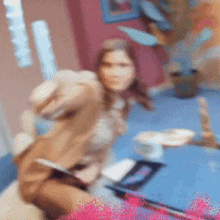 a blurry picture of a woman sitting on a bed