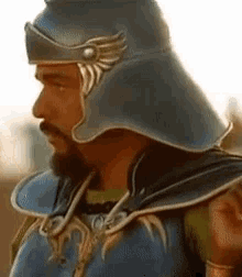 a man with a beard wearing a helmet and armor