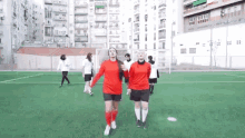 walking soccer playing football sisters