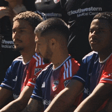 a group of soccer players wearing southwestern medical center shirts