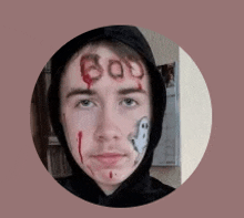 a man with boo painted on his face