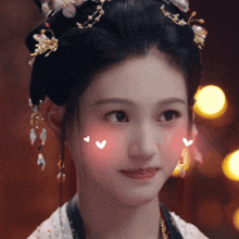a close up of a woman 's face with hearts on it