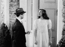 a black and white photo of a man and a woman