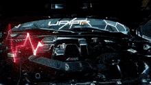 a car is driving through a dark room with a heartbeat monitor on the hood .
